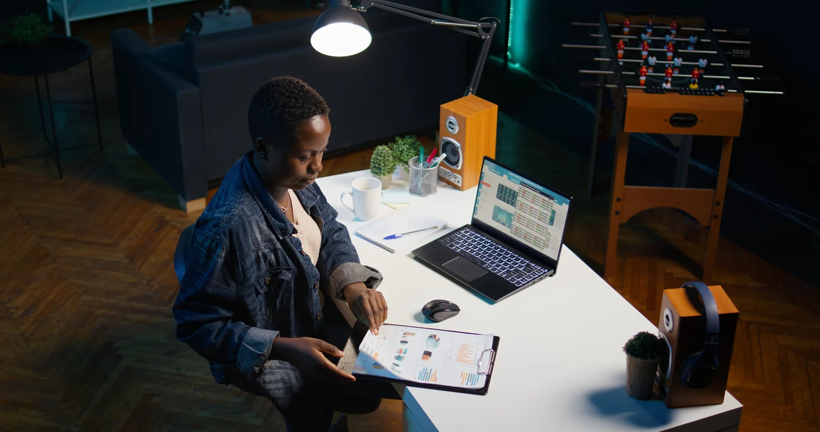 Woman working from home preparing for business meeting looking at charts designing marketing strategy. Teleworker doing research analysis for startup organization, camera B